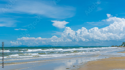 Peaceful tropical coastline with cloudy skies and reefs, background, Chanthaburi, Thailand 
