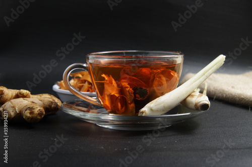 Picture of traditional herbal drink that contains ginger, clove, limegrass, cinnamons and secang (Caesalpinia sappan L) for immunity improvement photo