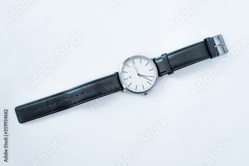 Hand Watch Isolated on White Background. Men's silver watch with a black strap. 