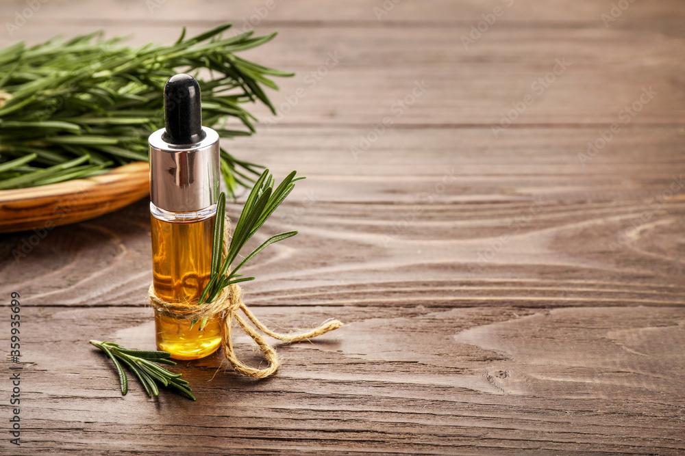 Fototapeta premium Aromatic rosemary oil and rosemary sprigs