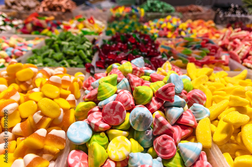 Colorful oriental sweets of various shapes on a market counter