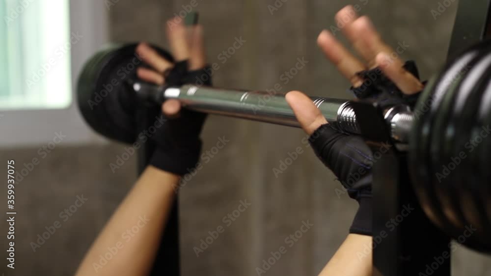 Close up Hand of a man hold tight dumbbell bar and lift up at home gym. Close up Hand of a man hold tight dumbbell bar and lift up at home gym.