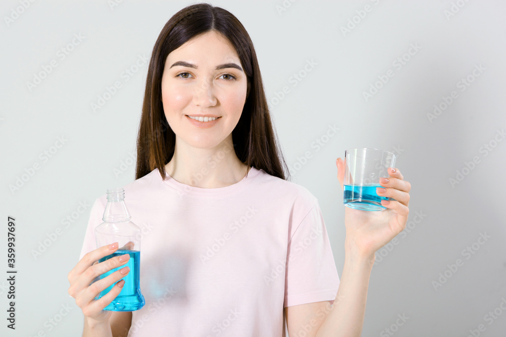 young girl uses mouthwash at home
young girl uses mouthwash at home