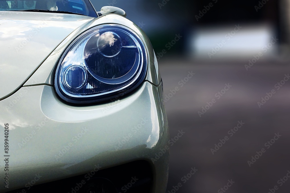 close up front view white sport car with big headlight