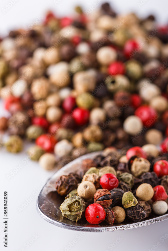 mix of peppercorns on white acrylic background mix of peppercorns on white acrylic background