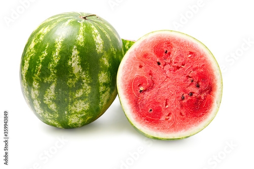 Fresh organic green watermelon and sliced half of watermelon with red texture. close-up