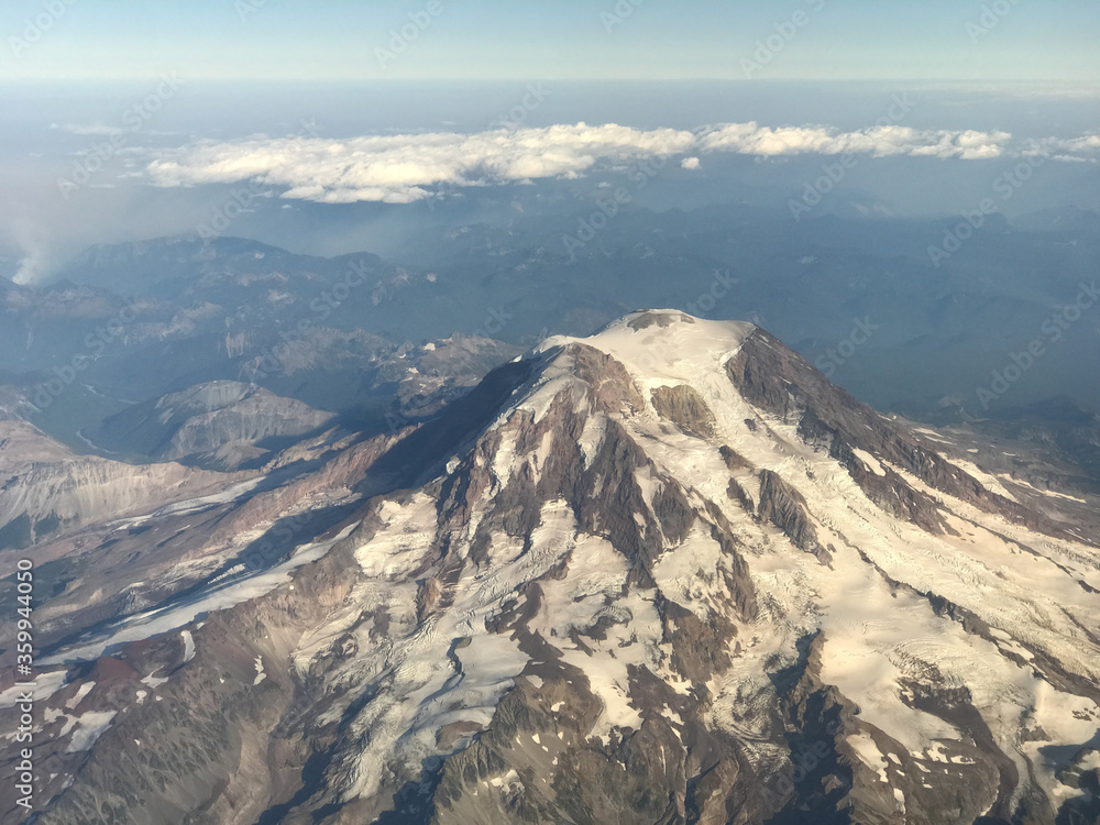 Summit of Mount Rainier Washington as seen from an aerial view of the national park in the Cascades