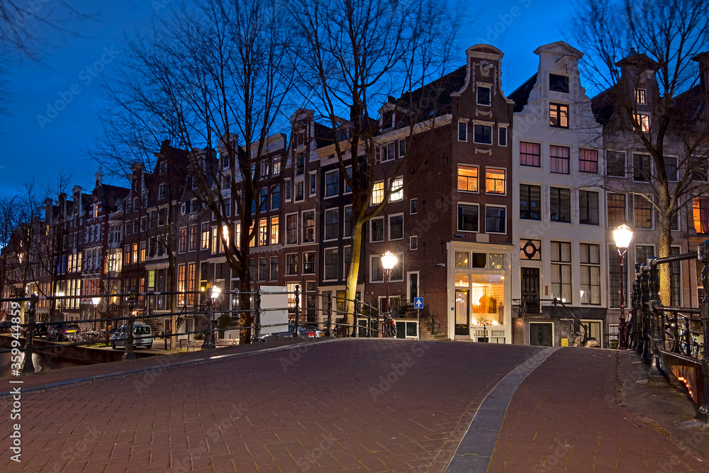 Fototapeta premium City scenic from Amsterdam in the Netherlands at sunset