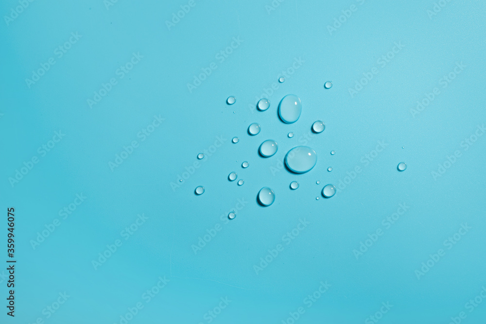 Different sized droplets on blue background Different sized droplets on blue background