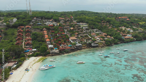 Coast Jungut Batu village with boats and hotels on the island of Lembongan. Indonesia. Aerial view. photo