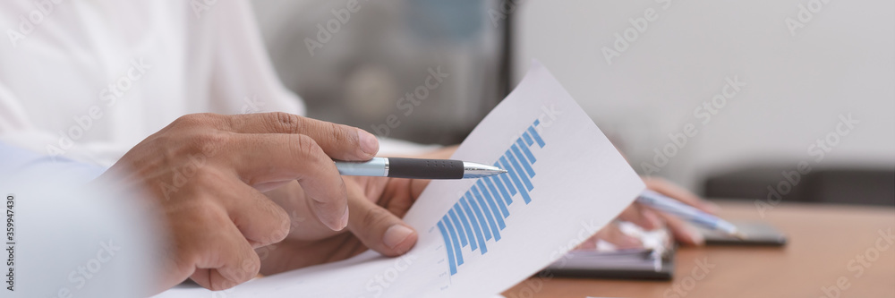 Close up hand point graph and talk job in business meeting. Close up hand point graph and talk job in business meeting.