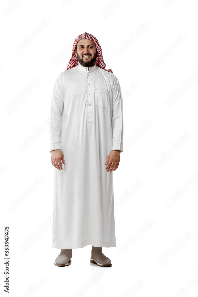 Smiling arabian man's portrait isolated on white studio background. Nationality, culture, inclusion, diversity. Confident business man in traditional middle eastern clothes with headscarf. Business.