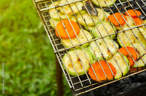 Grilled vegetables on the grill. Grilled zucchini and carrot