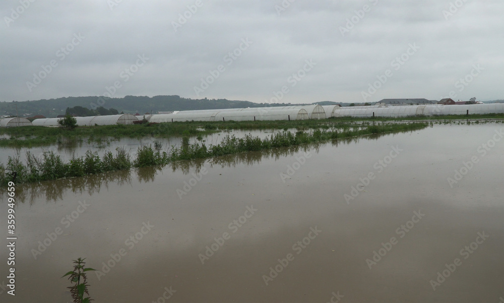 After hard rain cultivated fields are flooded by the Ukraine