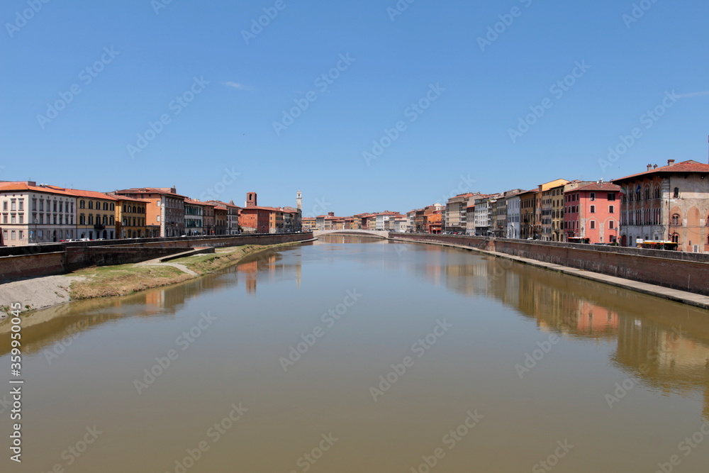 The Arno river and the Conte Ugolino bridge called Ponte di Mezzo seen from Ponte della Fortezza in Pisa, Italy.