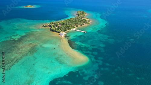 Aerial drone photo of tropical exotic island of Agia Triada in Evian bay next to famous seaside village of Eretria, central Evia island, Greece