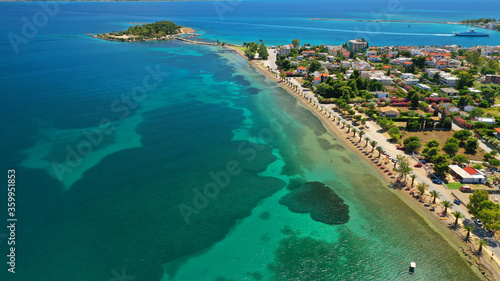 Aerial drone photo of famous island of dreams or Pesonisi connecting with small road with seaside fishing village of Eretria, Central Evia island, Greece
