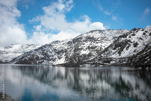 Tsogmo lake and snow covered hills.