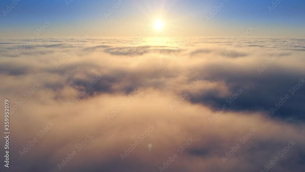 Flying backwards over majestic clouds, with the sun shining gold above the horizon and illuminating the scene with warm colors
Flying backwards over majestic clouds, with the sun shining gold above the horizon and illuminating the scene with warm colors