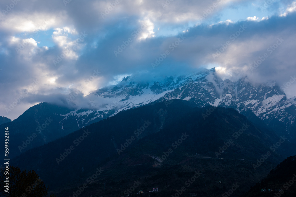 mountain peak and blue clouds in the morning 