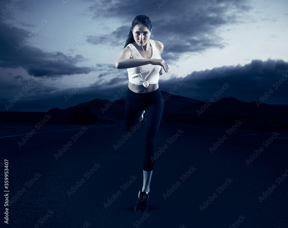 Sporty young woman running on road background Sporty young woman running on road background