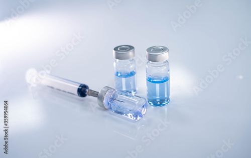 close up vaccine and syringe injection for prevention from virus infection