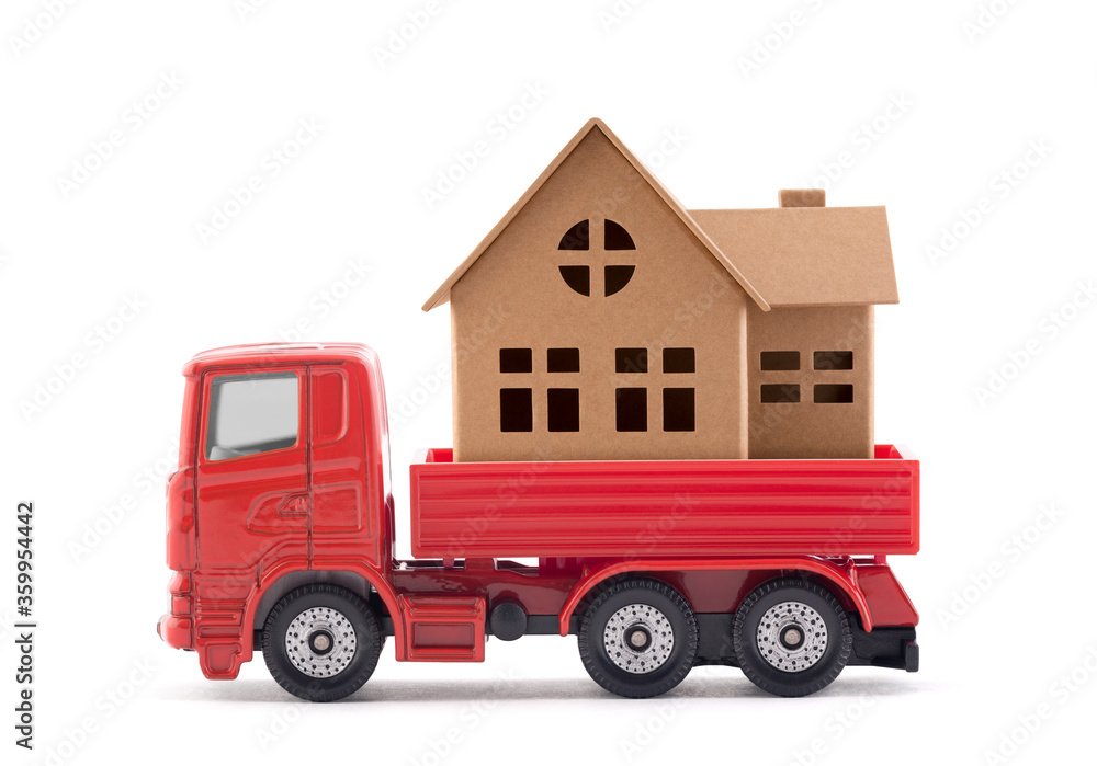 Red truck miniature with house on white background Red truck miniature with house on white background