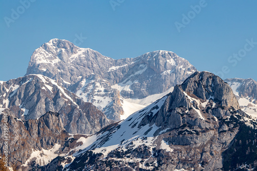 Triglav mountain covered in spring snow © klemen