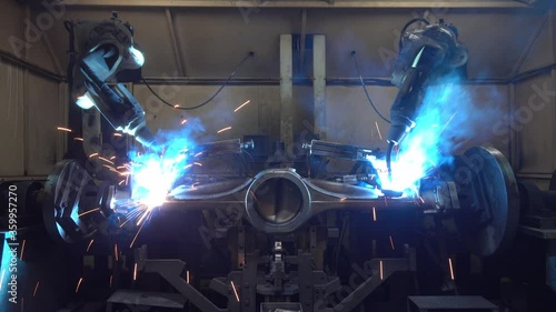 Automation welding mechanical procedure.,Industrial Robot arm active in factory