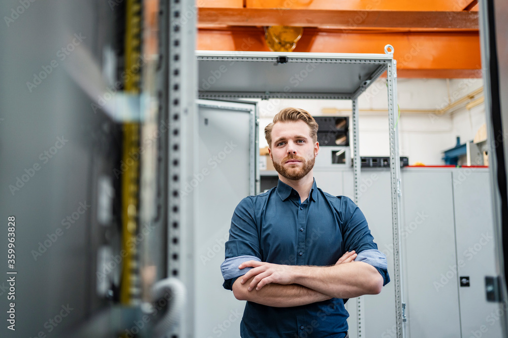 Portrait of a confident young man in a factory Portrait of a confident young man in a factory