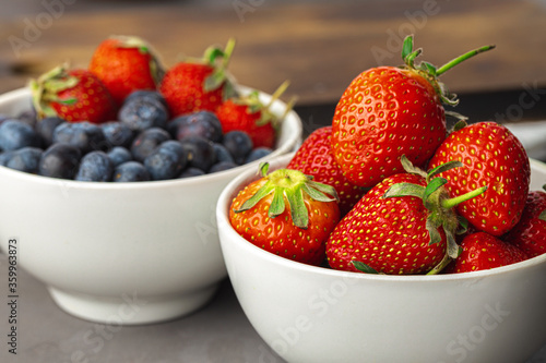Fresh ripe strawberry and blueberry in bowl