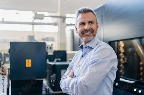 Wallpaper Mural Portrait of a confident businessman in a factory Torontodigital.ca
