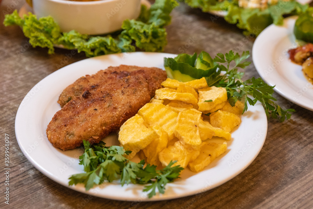 Cutlet with fried potatoes close up Cutlet with fried potatoes close up