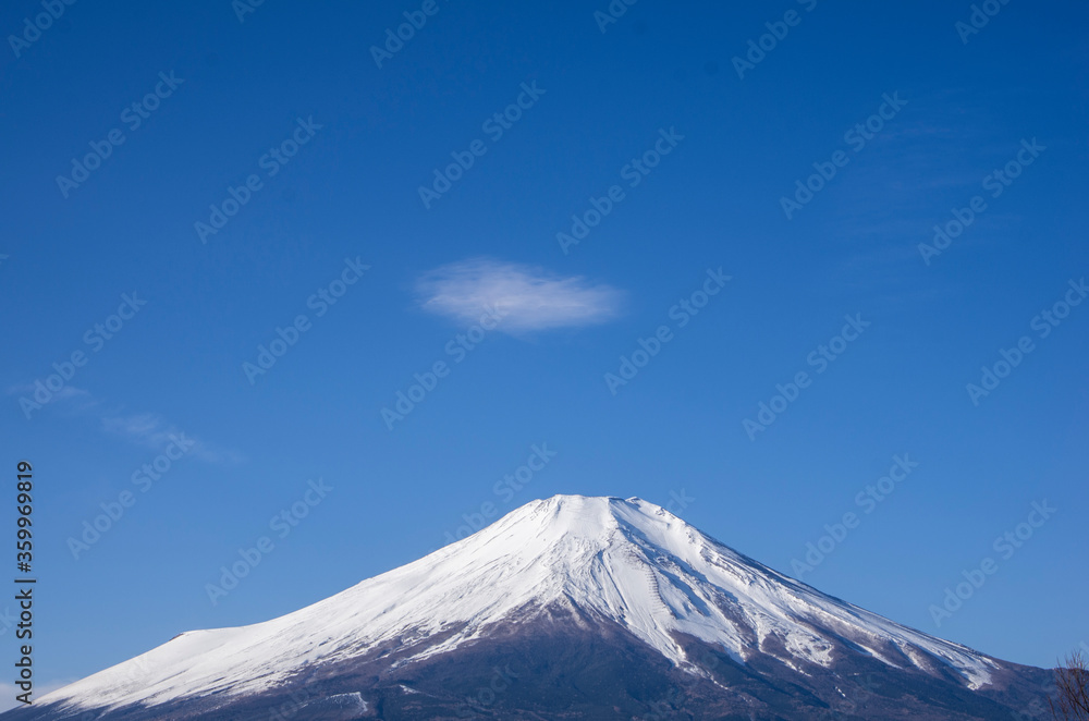 Small piece of cloud floating at the Mountain top of Mount Fuji's snowcap, from Lake Yamanaka