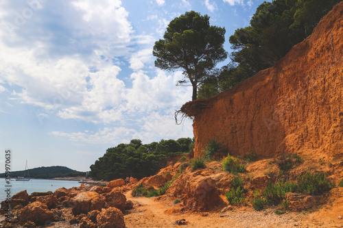 Beautiful, naturally created red sand beaches at Vrgada island by landslides, making this isolated island popular tourist attraction in Croatian part of Adriatic coast