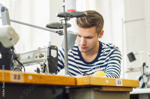 Sewer at work in a tailor shop photo