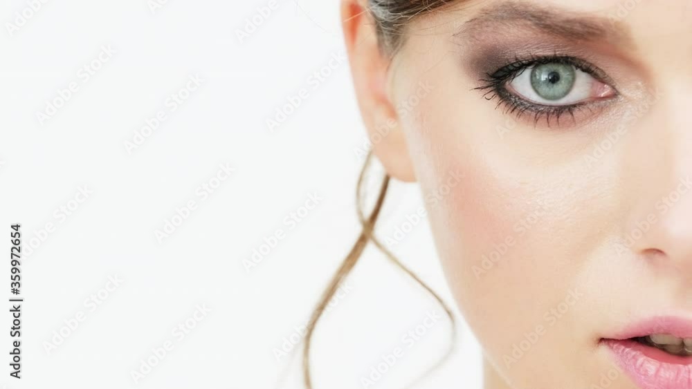 Half face of Beautiful healthy woman with fresh skin of face. Female eye with bright dark make-up. Woman's face with a blue eye. Woman eye with long black eyelashes. Cosmetics concept. Half face of Beautiful healthy woman with fresh skin of face. Female eye with bright dark make-up. Woman's face with a blue eye. Woman eye with long black eyelashes. Cosmetics concept.