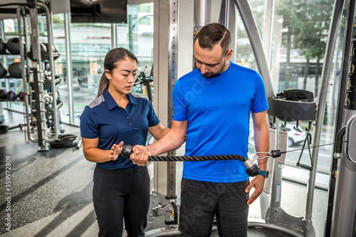 Physiotherapist working with client on rehabilitation exercises