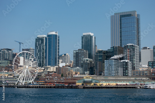 Panoramic view of the city of Seattle Washington skyline and the great wheel Ferris wheel.