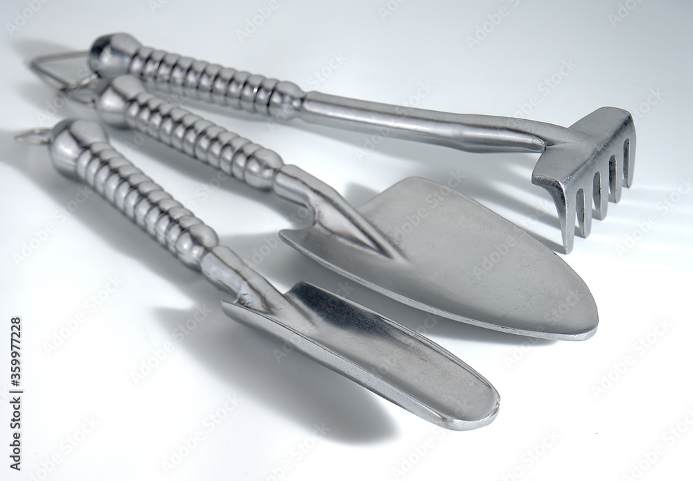 set of three aluminum garden hand tools on white background set of three aluminum garden hand tools on white background
