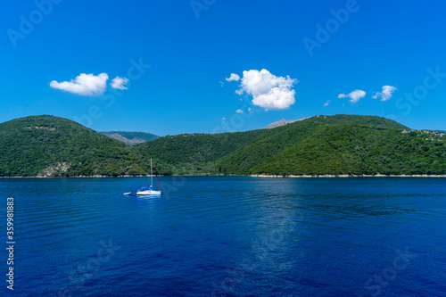 Unbeleivable view towards a beautiful yacht and hills in Ionion sea, Greece