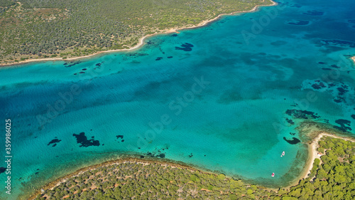 Aerial drone photo of beautiful paradise island complex in gulf of Petalion that form a blue lagoon in South Evia island near Marmari, Greece