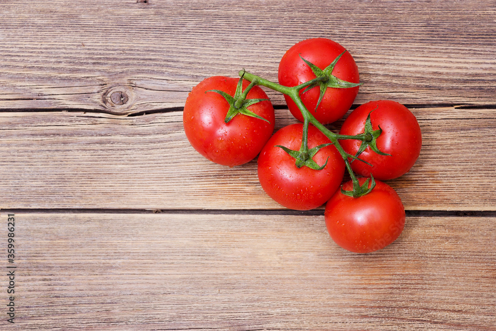 Close-up of fresh, ripe cherry tomatoes on wood Close-up of fresh, ripe cherry tomatoes on wood