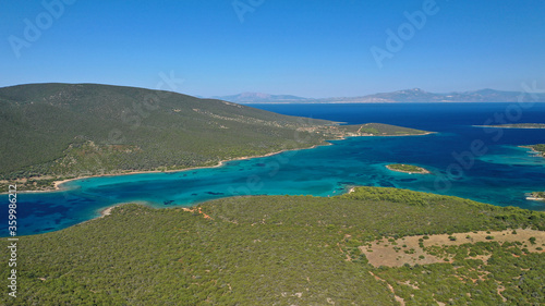 Aerial drone photo of beautiful paradise island complex in gulf of Petalion that form a blue lagoon in South Evia island near Marmari, Greece © aerial-drone