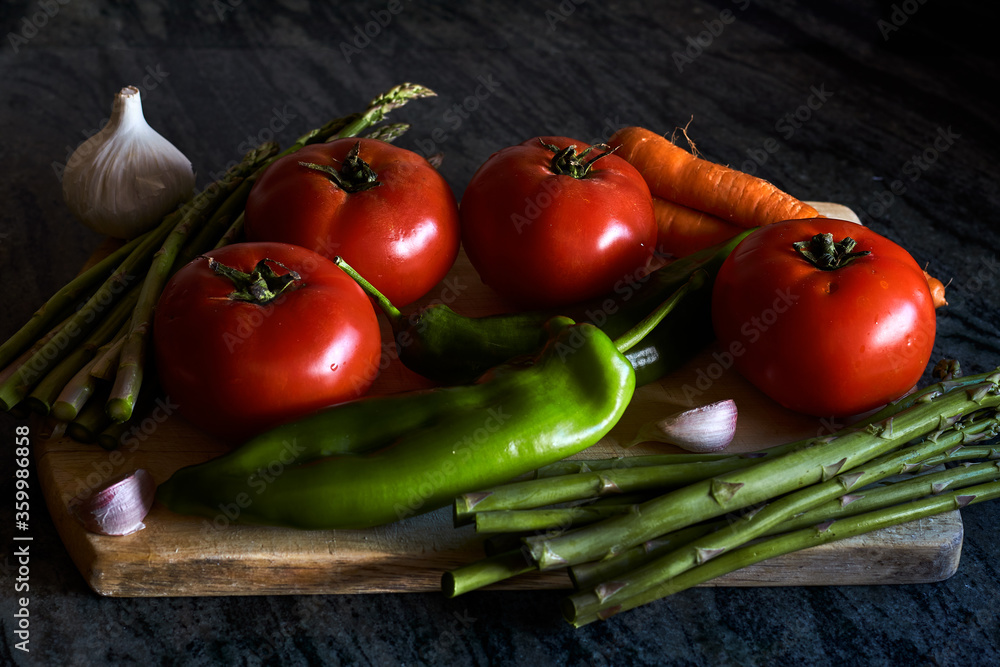 Vegetables still life with tomatoes, peppers, carrots, asparagus and garlics Vegetables still life with tomatoes, peppers, carrots, asparagus and garlics