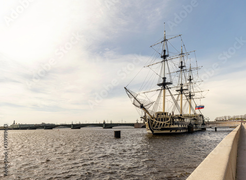 An old sailing frigate on the Neva river in Saint Petersburg   Russia. An old ship is parked on the embankment of the Neva river.