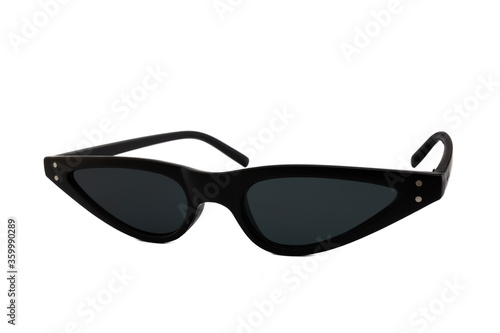 Black triangular cat eye sunglasses with thick frames and black matte lenses isolated on white background. Side View.