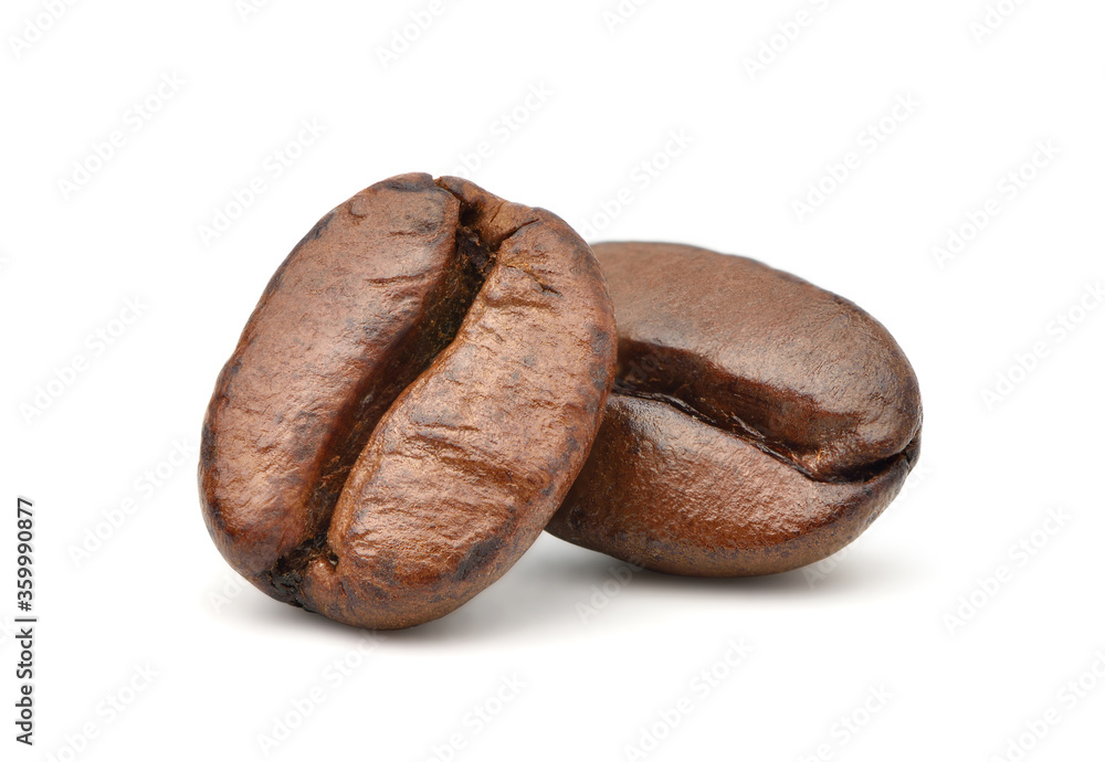 Close-up Two roasted coffee beans isolated on white background. Clipping path Close-up Two roasted coffee beans isolated on white background. Clipping path