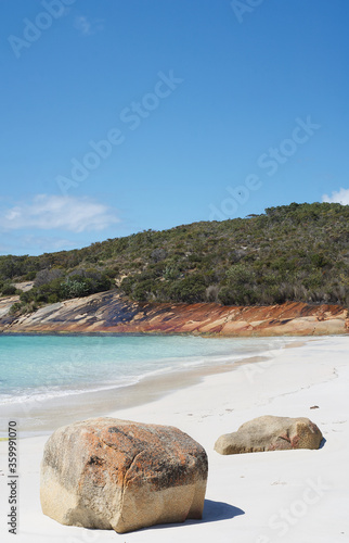 Rocks on the beach in a secluded bay photo