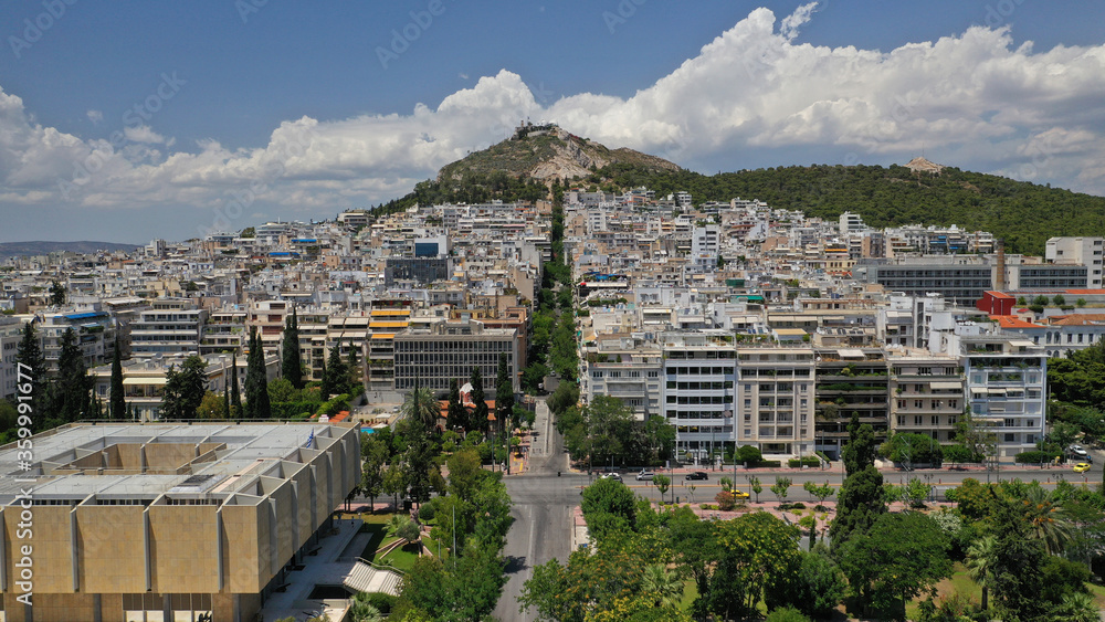 Aerial drone panoramic photo of Lycabettus hill and Athens urban cityscape with beautiful sky and clouds, Attica, Greece
